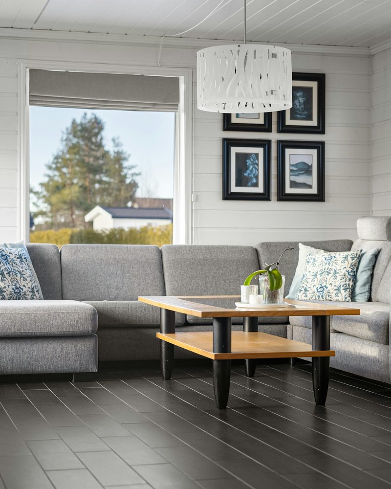 Grey luxury vinyl tile (LVT) plank flooring in a contemporary living room